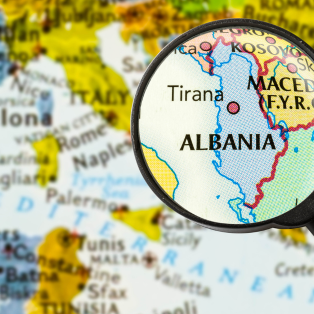 Map of Albania with magnifying glass highlighting it